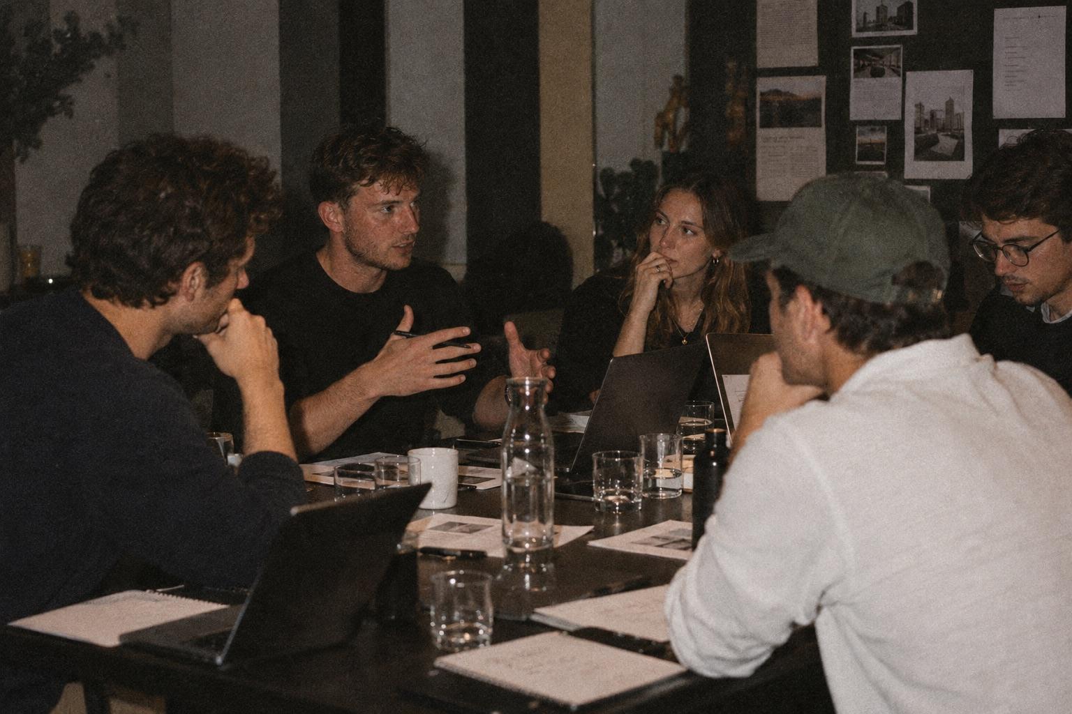 Members in discussion around a table